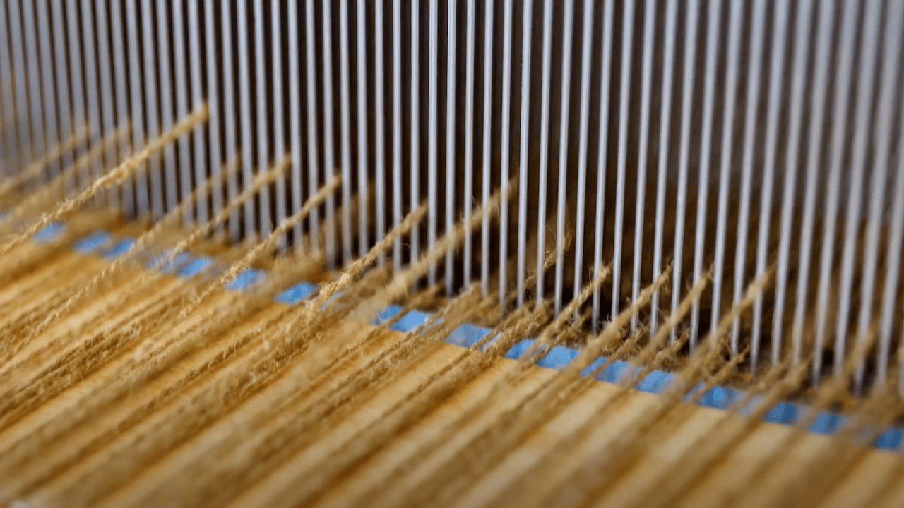 Changing the shed on a floor loom