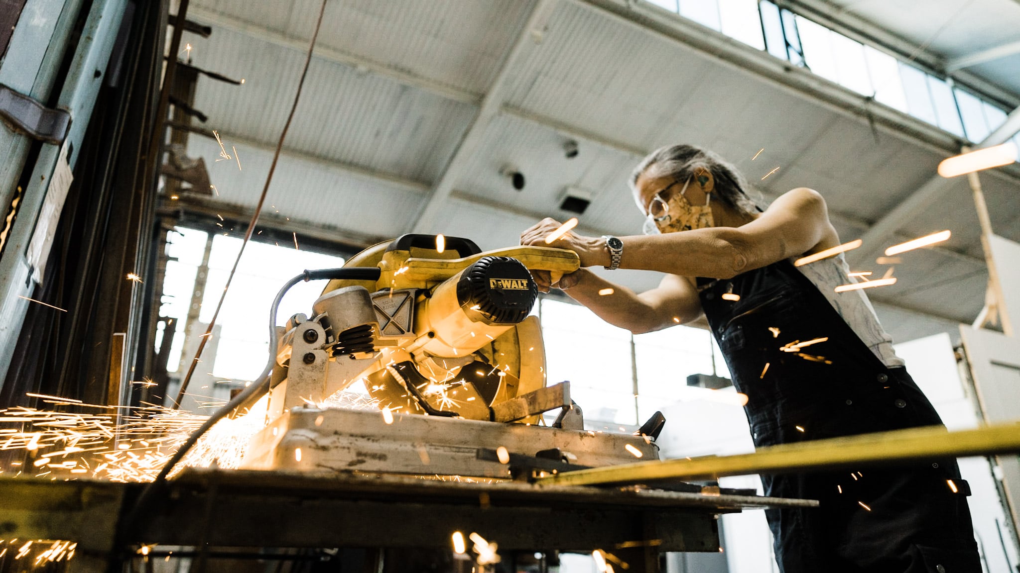 Sparks flying from a machine being used by Heather McLarty at Adam's Forge in Los Angeles, California. Photo by David Haskell.