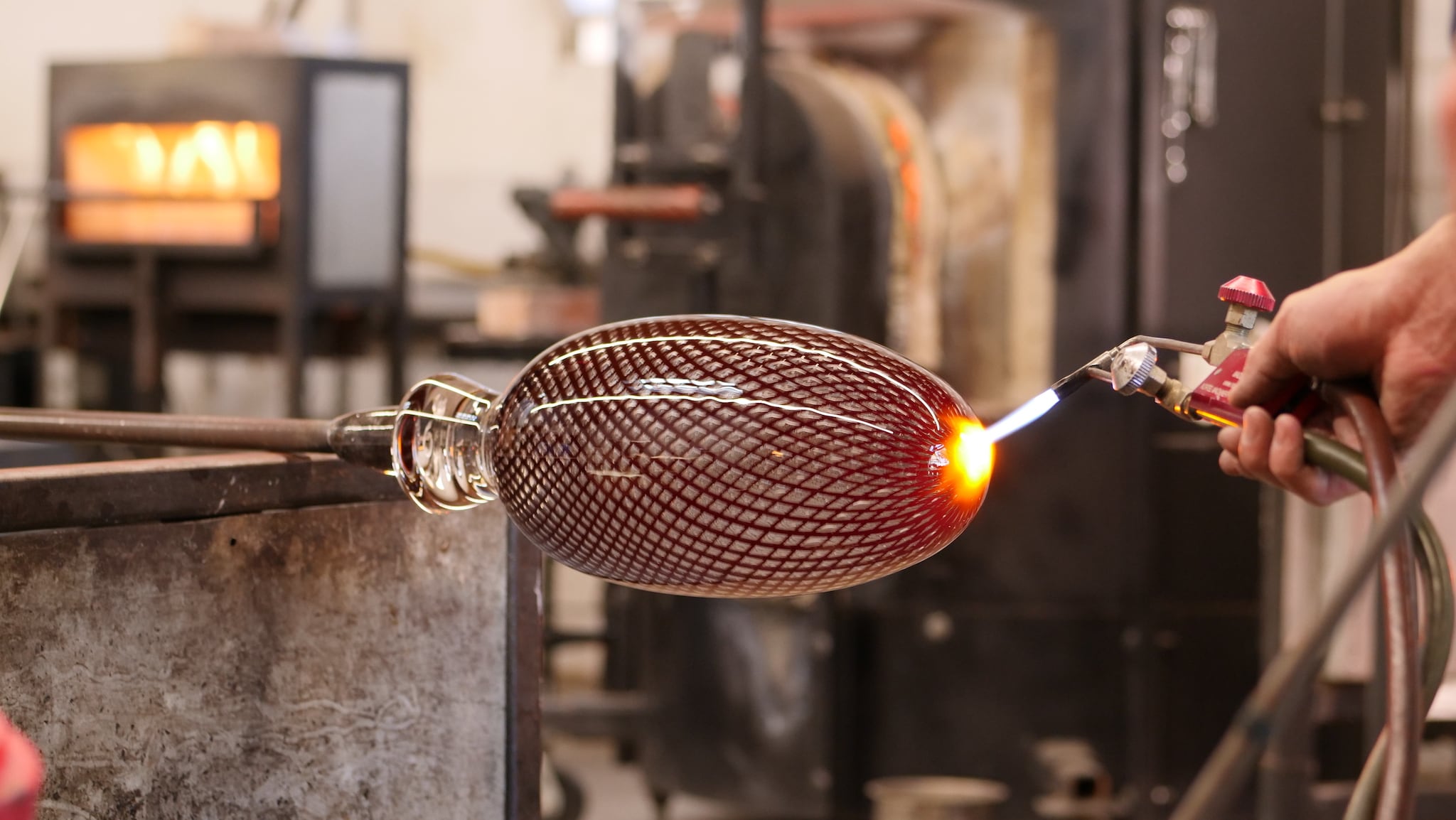 Reticello glass object being torched at KT Glassworks in Los Angeles, California.